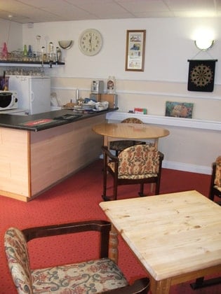 Falstone Manor Care Home - Wooden bar and tables