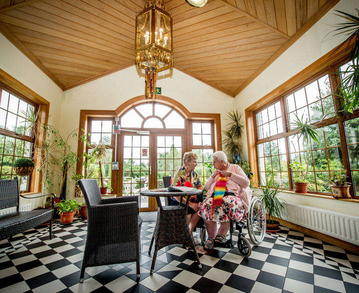 image of knockmoyle-lodge-lady-knitting