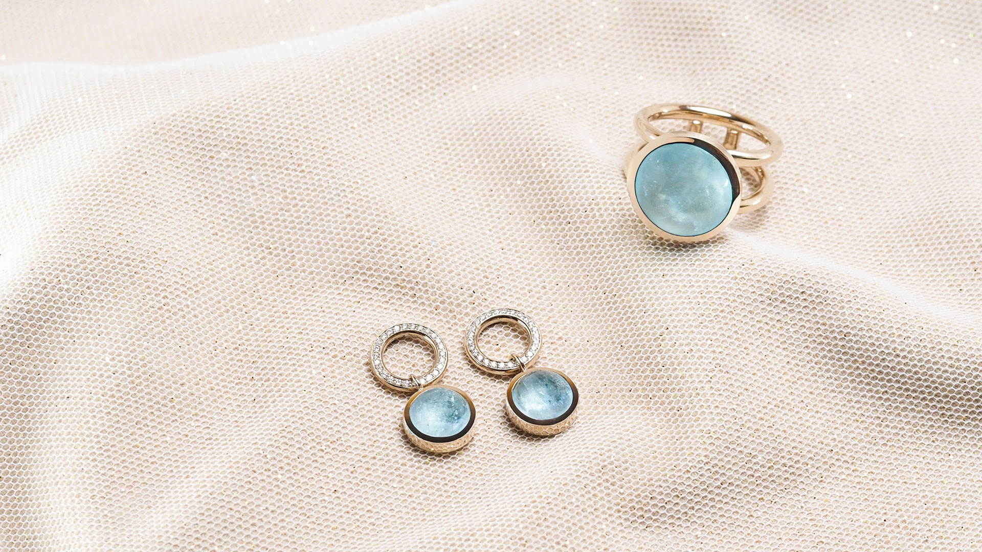 Ohrhänger und Ring in Champagnergold mit Aquamarin und Brillant