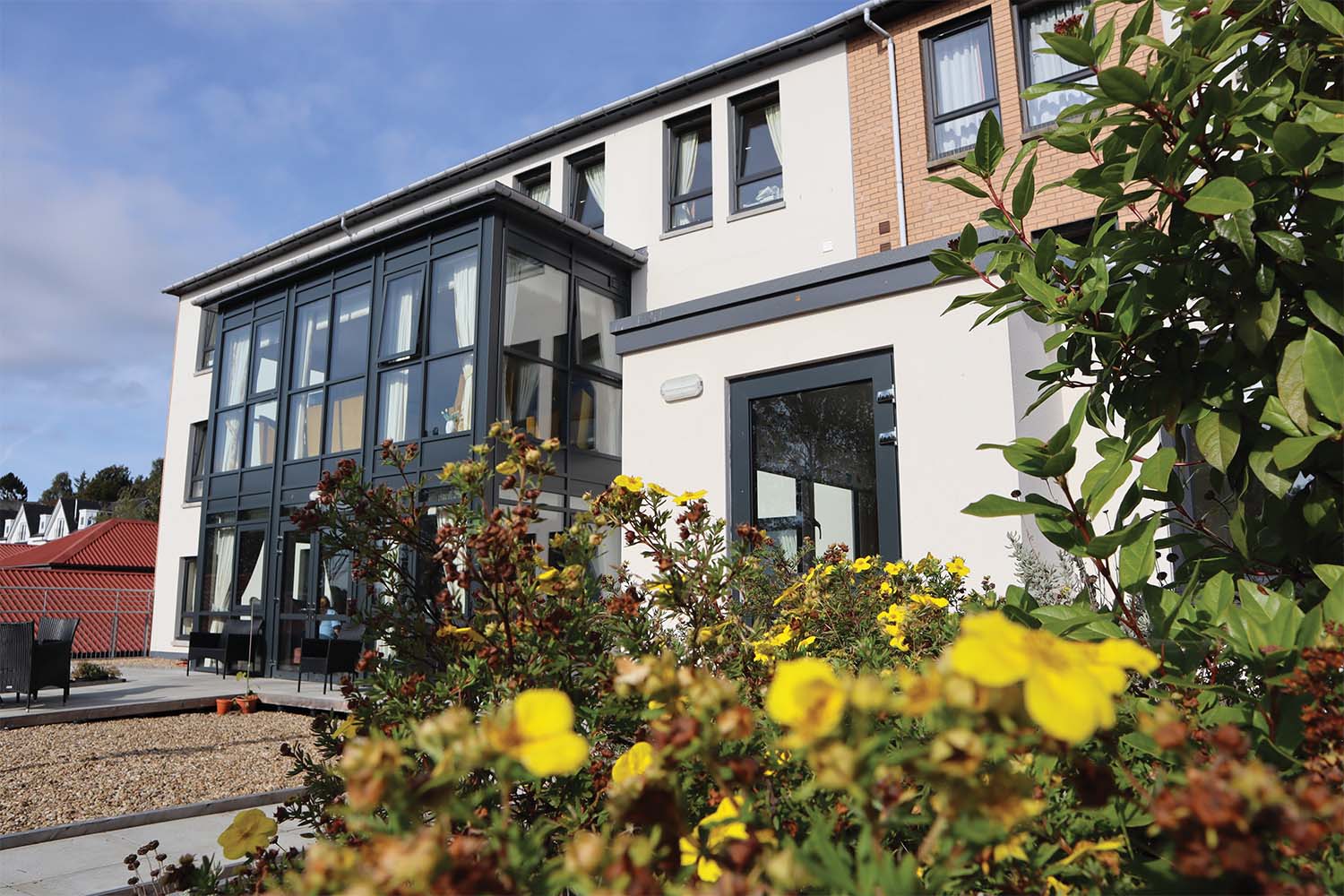 front of westerton care home with flowers in foreground