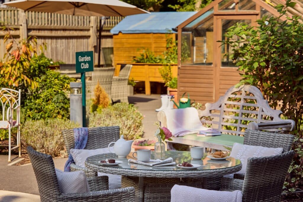 Garden seating area with coffee and cake.